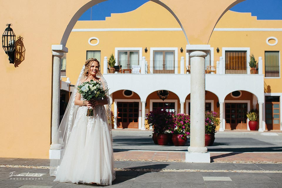 Bride outside the catholic church ready to walk in for the wedding ceremony